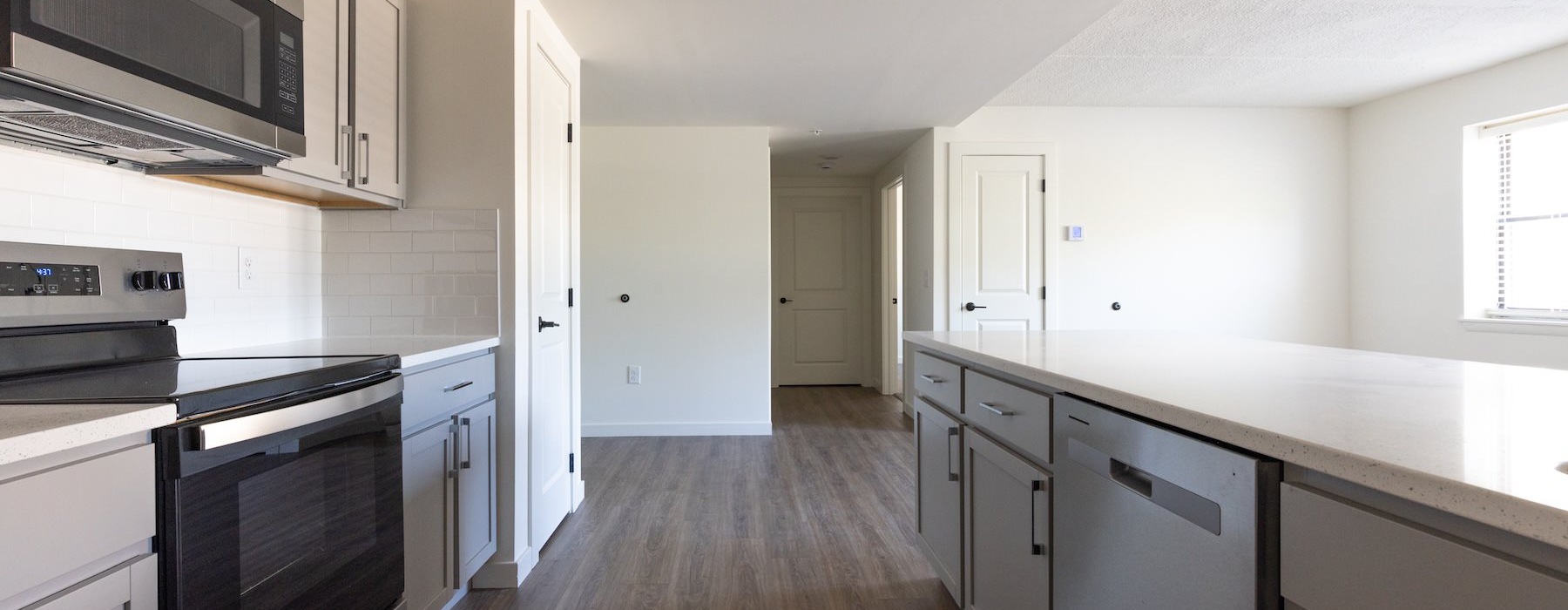 a kitchen with white cabinets